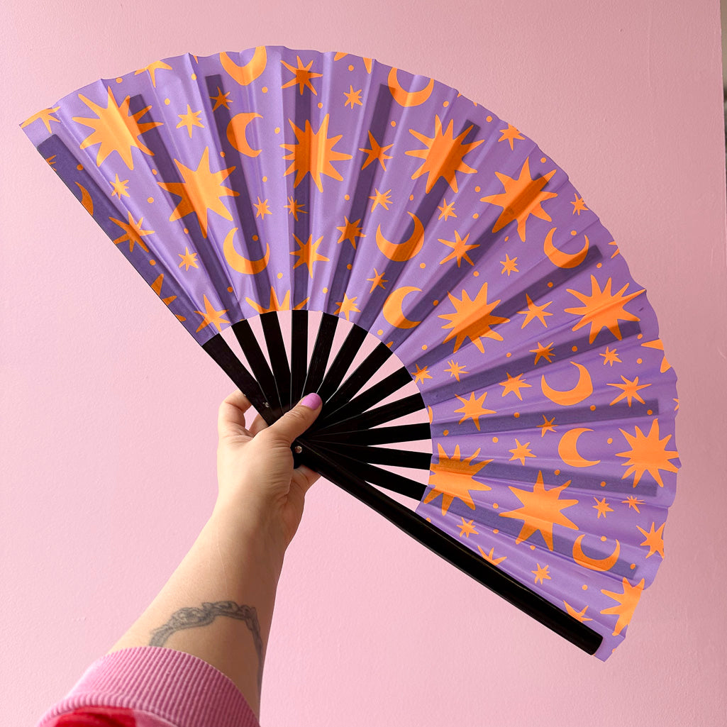 Giant Clacking Hand Fan with Purple & Orange Celestial print (Glows in UV!)