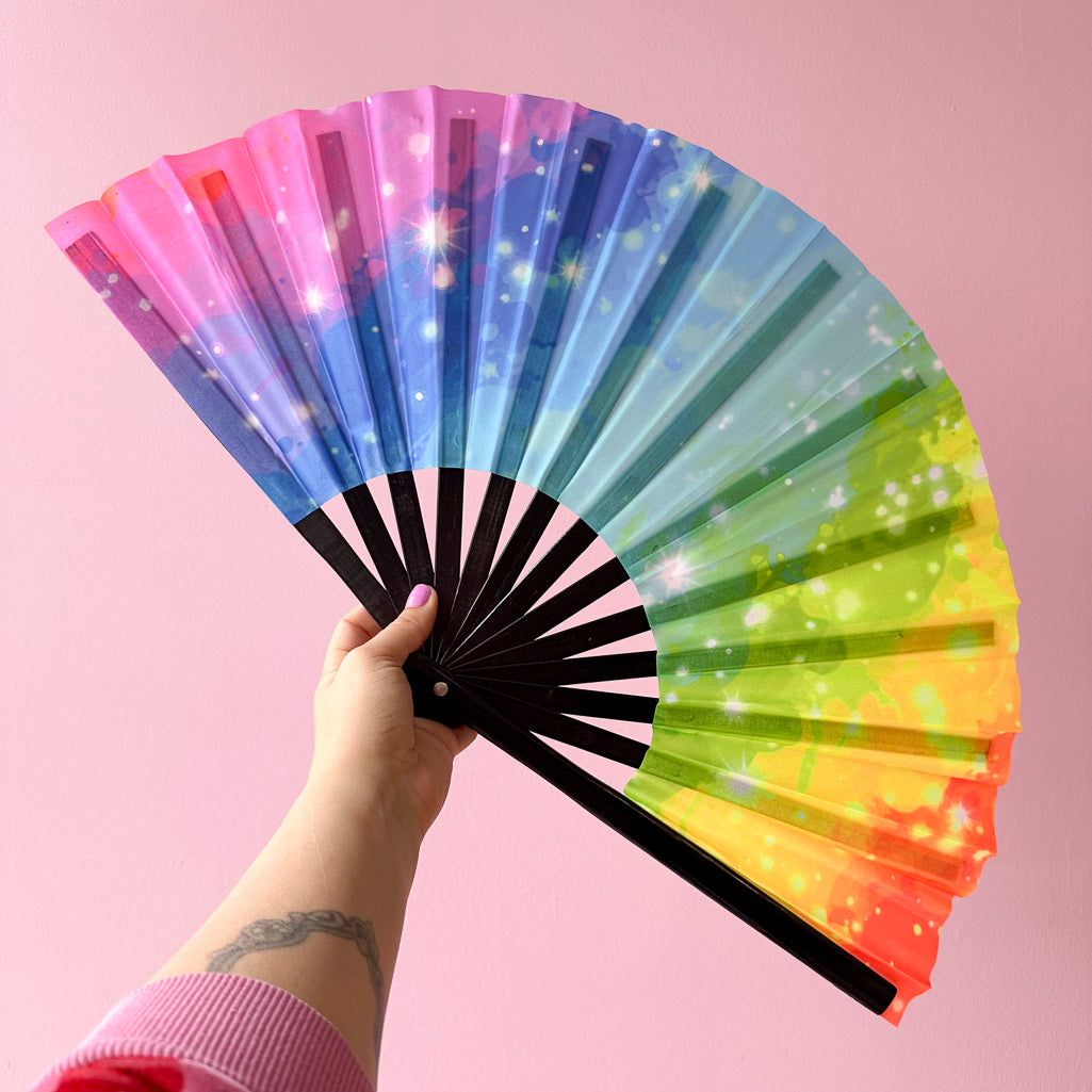 Giant Clacking Hand Fan with Starry Painted Rainbow print (Glows in UV!)