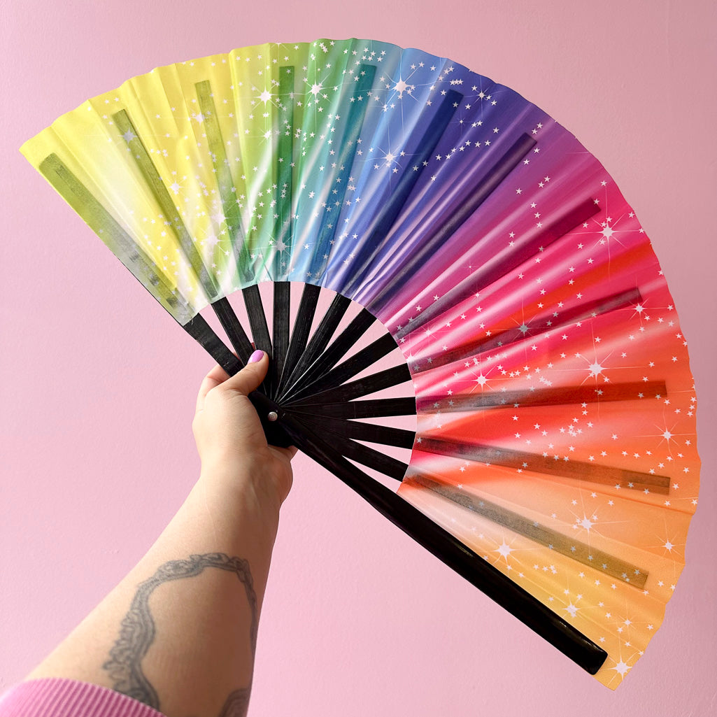 Giant Clacking Hand Fan with Starry Rainbow print (Glows in UV!)